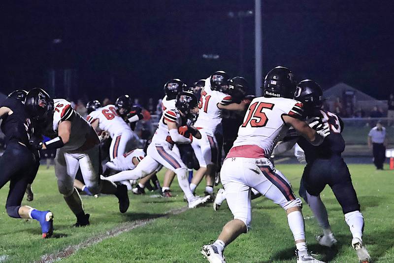The Panther offensive line #75 Caleb Reymer, #60 Mason Minssen,#51 Derek Naftzger, and #15 Evan Steimle created a huge hole for running back #22 Tristan Hovey to cruise across the goal line Friday, Oct. 10, 2025, in Orion. The Panthers dominated the conference matchup against the Chargers, taking home their 5th win for the season.