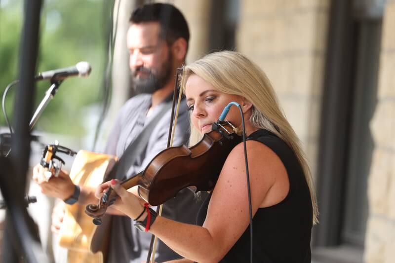 Anne Hatfield-Martin performs on the balcony of USF Motherhouse. The Upper Bluff Historic District hosted Porch & Park Music Fest featuring a variety of musical artist at five different locations. Saturday, July 30, 2022 in Joliet.