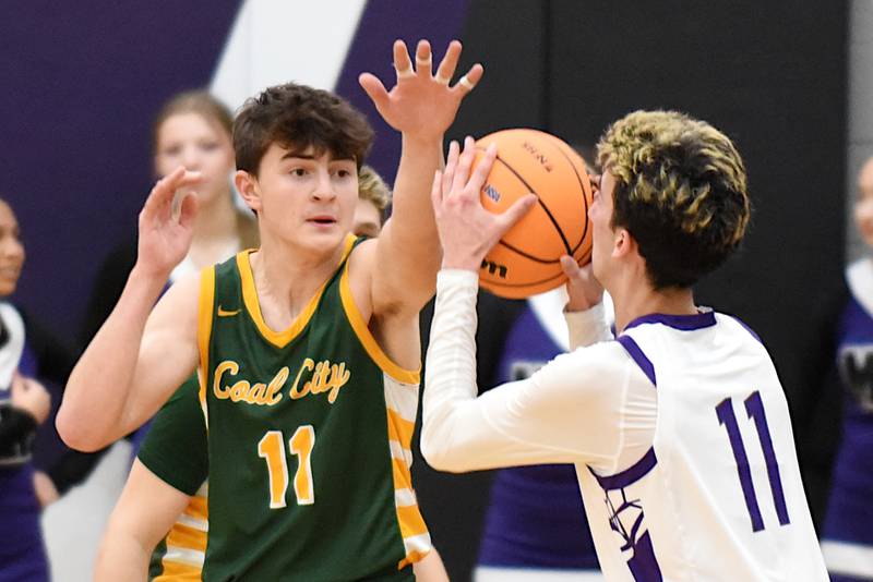 Coal City's Connor Henline, left, defends a shot from Manteno's Braden Campbell during the IHSA Class 2A Manteno Regional quarterfinals at Manteno Monday, Feb. 23, 2026.