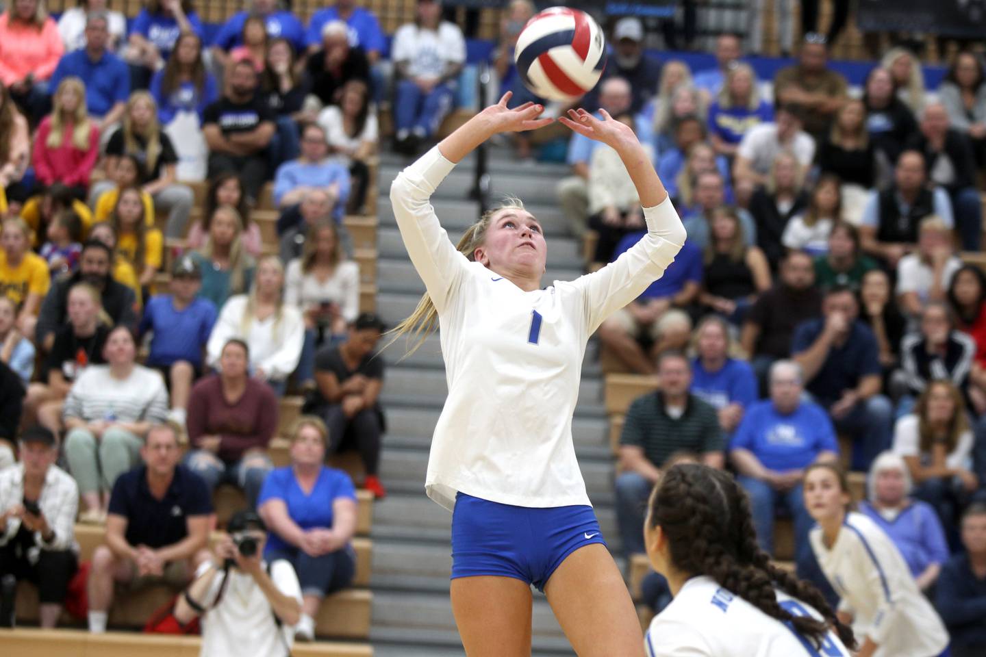 St. Charles North’s Jessica Parker sets the ball during a home game against St. Charles East on Tuesday, Oct. 4, 2022.