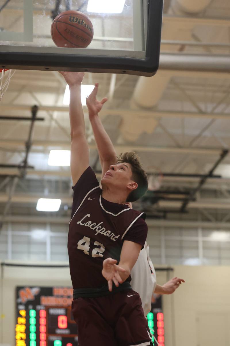 Lockport’s Caden Schoolcraft lays in a shot against Minooka.