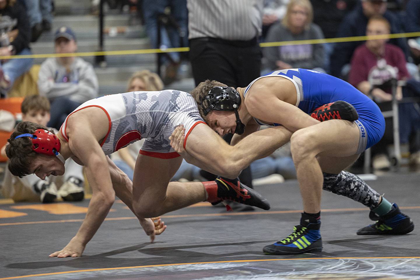 Oregon’s Nelson Benesh looks to scramble away from Princeton’s Kane Dauber in the 138 pound first place match Saturday, Feb. 14, 2026, during the Class 1A wrestling sectionals in Byron.