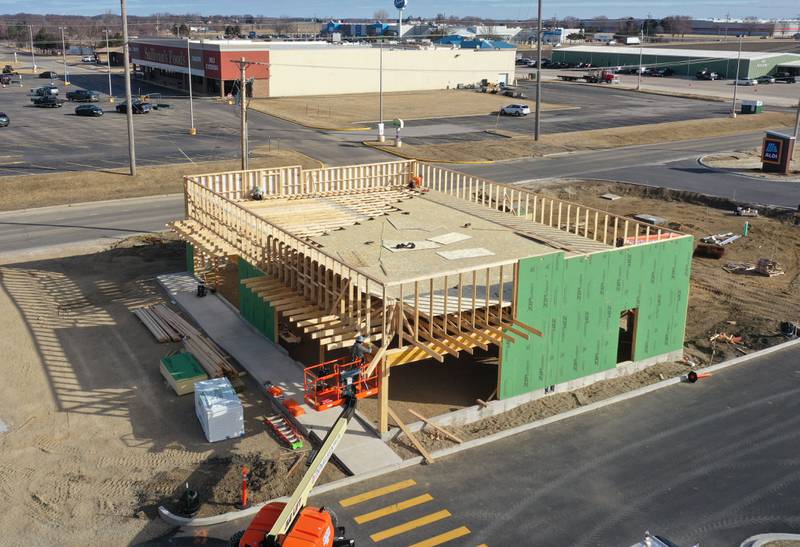 Crews build the top and sides of Jersey Mike's Subs on Monday, Feb. 23, 2026 in Princeton.