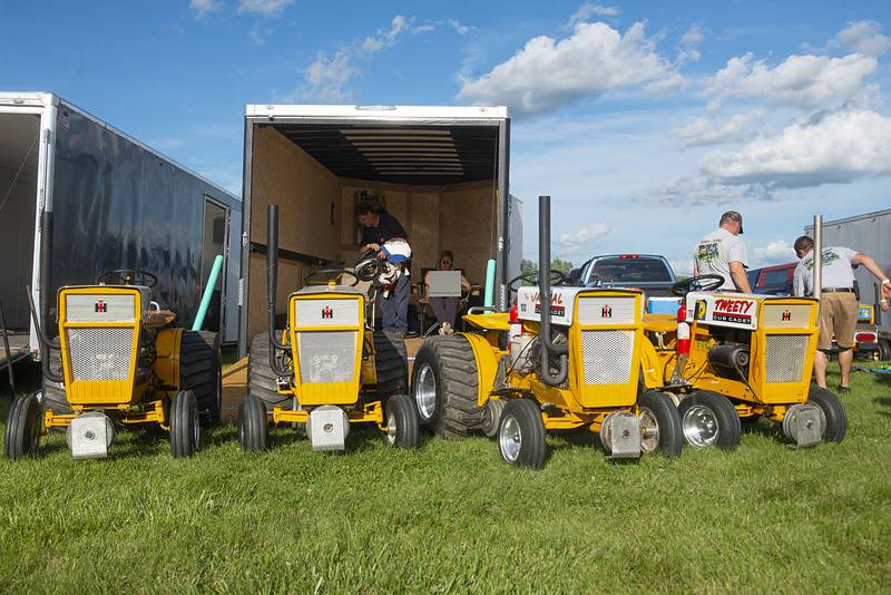 Colorful garden tractors line up for a pulling event Thursday, July 28, 2022 at the Lee County 4H fair.