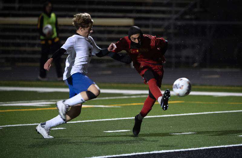 St. Anne's Diego Guerrero, right, takes a shot as goal as Clifton Central's Ryder Williamson, left, defends in a regional match-up on Tuesday, October 21, 2025.