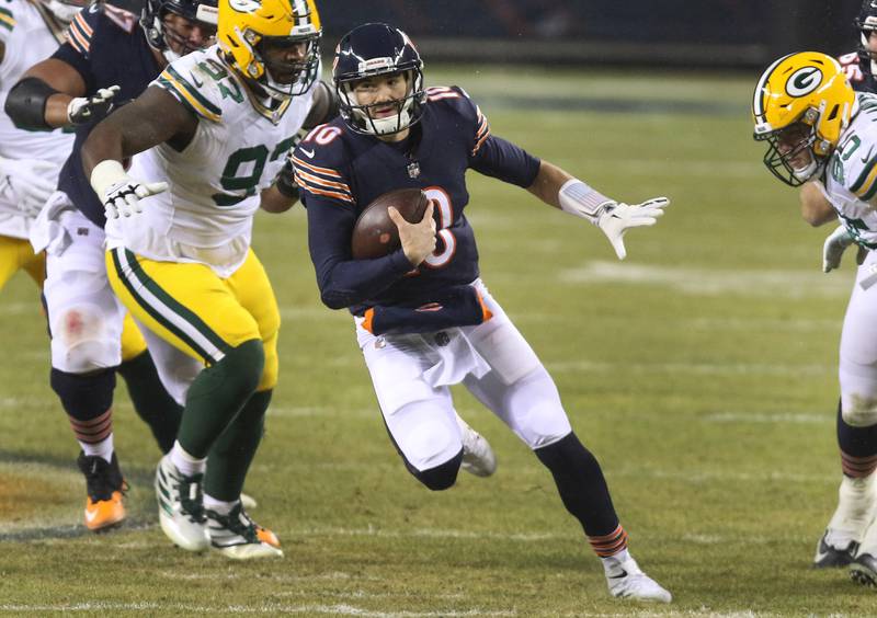 Chicago Bears quarterback Mitchell Trubisky (10) scrambles away from the Packers pass rush during their game Sunday at Soldier Field in Chicago.