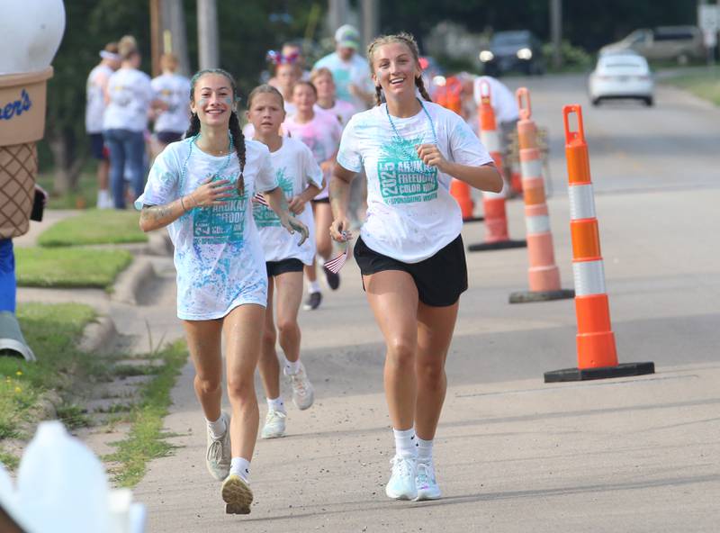 Evelyn Brown and Ava Munson race during the Arukah Institute of Healing Freedom Color Run on Friday, July 4, 2025 at Soldiers and Sailors Park in Princeton.