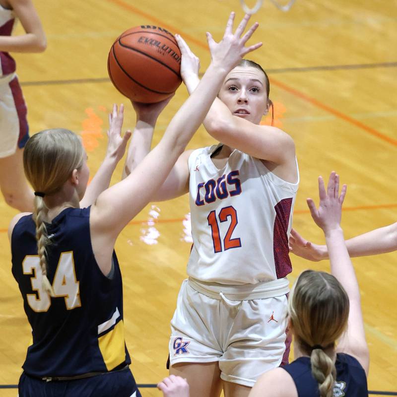 Genoa-Kingston's Ally Poegel gets up a shot over two Polo defenders during their game Monday, Jan. 29, 2024, at Genoa-Kingston High School.