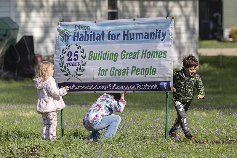 Layla, 3, Raelynn, 6, and Theodore, 4, McPherson play on the site of their soon-to-be home that will be built by Dixon Habitat for Humanity. The organization held its groundbreaking for the 34th home on Saturday, April 18, 2026.