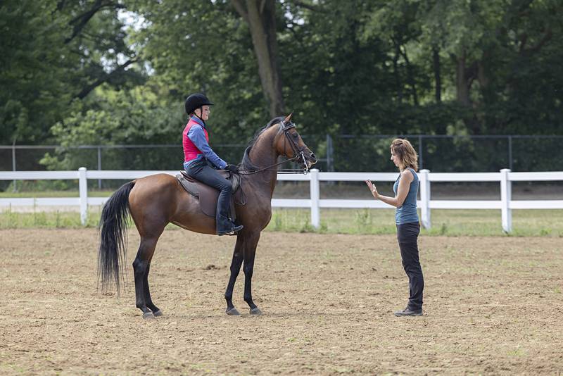 Maycie Simms, 13, gets instruction from Trudie Thomas Friday, July 14, 2023 while warming up for the English Pleasure class at the Whiteside County 4H show.