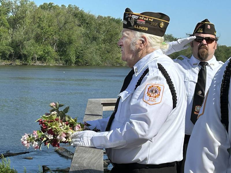 Vietnam War Veteran Jerry Frana prepares to throw a wreath into the Rock River from the overlook at Oregon Park East in honor of veterans who served at sea. The wreath dedication was part of  the Oregon VFW's Memorial Day services on Monday, May 26, 2025.