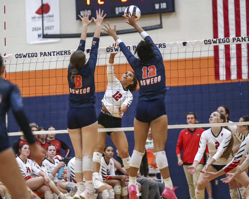 Yorkville's Tehya Knapp (12) smashes the ball over the net during volleyball match between Yorkville at Oswego. Sept 23, 2025.