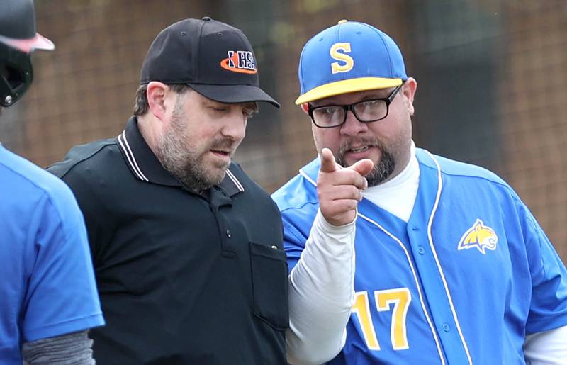 Somonauk head coach Troy Felton has a word with the umpire during their game against Hinckley-Big Rock Wednesday, May 4, 2022, at Hinckley-Big Rock High School.