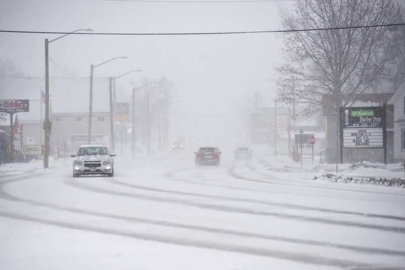 Sparse traffic travels along First Avenue in Rock Falls Saturday, Jan. 1, 2022, as combination of New Years Day closures and a blizzard made for staying at home a nice luxury.