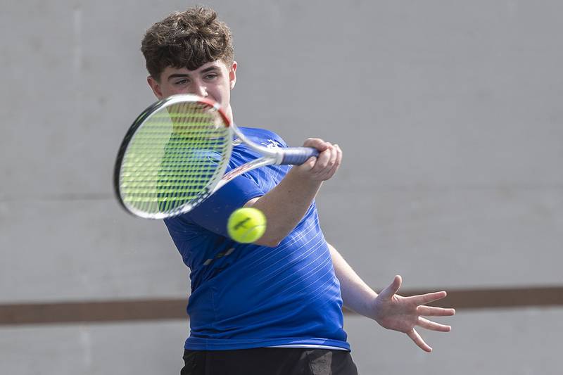 Newman’s JP Ryan returns a shot against Dixon while playing doubles Tuesday, May 9, 2023.