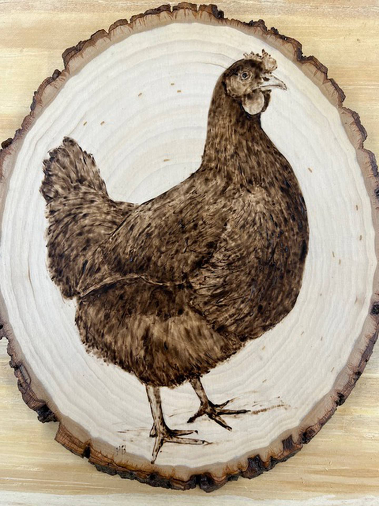 Wood burning art piece created by KVAL artist Pam Bradford