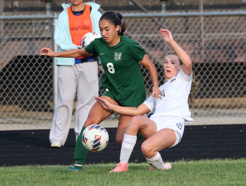 Kaneland's Olivia Davis (right) tries to kick the ball away from Boylan's Johanna Hawley Wednesday, May 28, 2025, during their Class 2A sectional semifinal game at Belvidere High School.