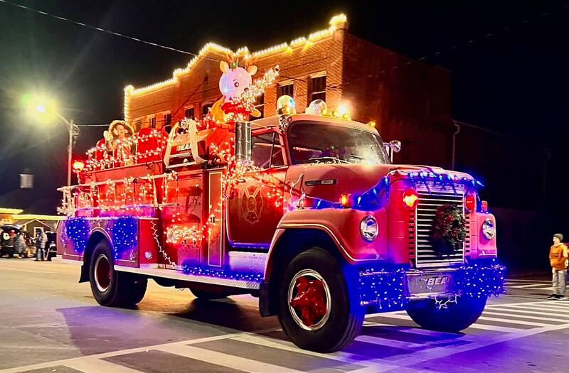 A lighted fire truck travels during the annual Christmas Parade on Friday, Dec. 6, 2024 in Princeton.