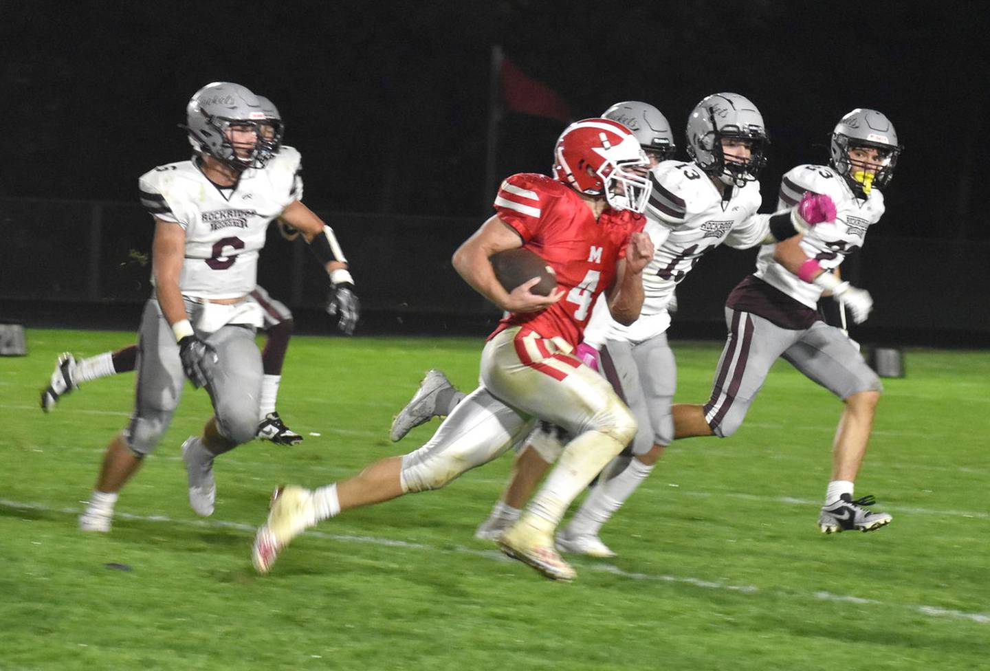Morrison's Brady Anderson runs the ball past Rockridge defense. The game remained scoreless until the fourth quarter. The final score was Mustangs 7, Rockets 14.