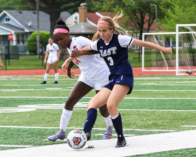 Oswego's Gillian Young (3) battles Oswego's Alexa Melton (14) during the Class 3A East Aurora Regional final between Oswego East vs. Oswego. May 20, 2022