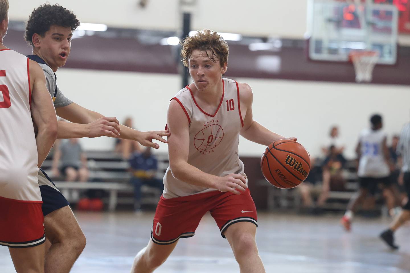 Ottawa’s Evan Snook makes a move to the basket against Neuqua Valley at the Morris Shootout on Tuesday, June 20, 2023.