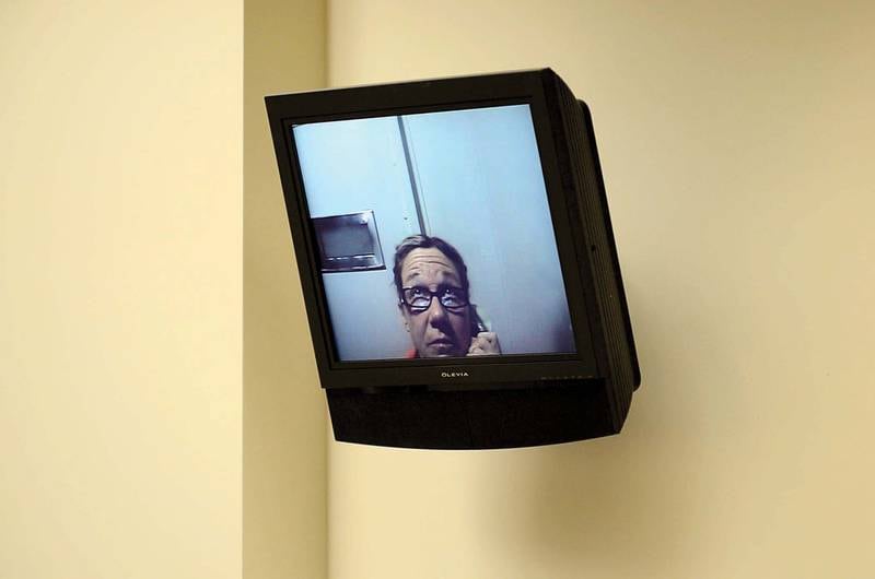 Appearing via closed circuit television, Rita Crundwell addresses the court March 4, 2013 during a status hearing in Lee County Court.