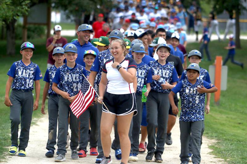 MCYSA intern Rachel Peat leads teams for an athlete parade during MCYSA 2023 Summer International Championships Opening Ceremonies Friday June, 14, 2023 at the Mickey Sund Complex in Lippold Park in Crystal Lake.