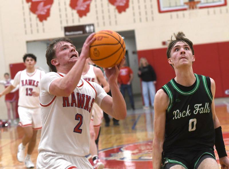 Oregon's Cooper Johnson (2) shoots a lay up as Rock Falls' Max Burns (0) looks to rebound on Friday, Jan. 9, 2026 at the Blackhawk Center in Oregon.