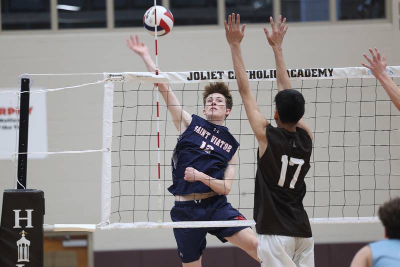 St. Viator’s Adrien Ruzic goes up for the shot against Joliet Catholic on Wednesday, April 24, 2024 in Joliet.