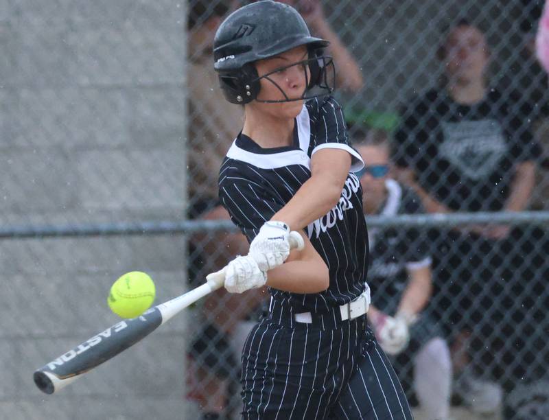 Woodland's Emme Wallace makes contact with the ball on Tuesday, May 12, 2026 at Woodland High School.