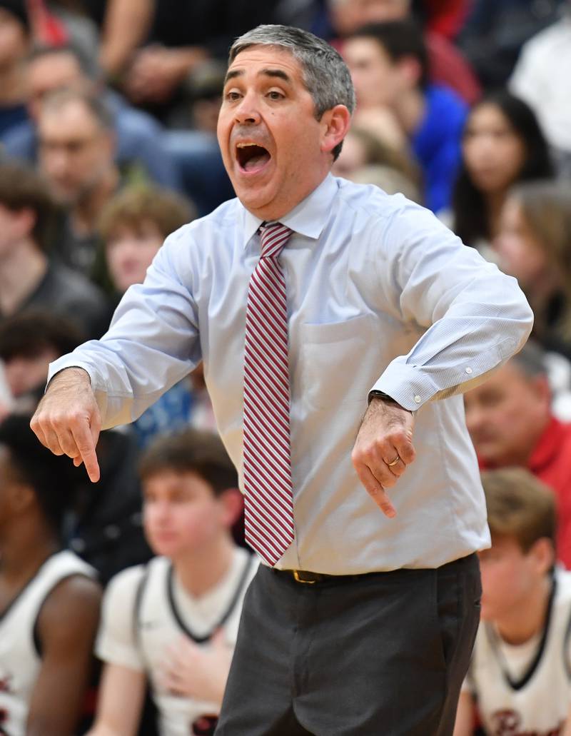 Benet Academy boys basketball coach Gene Heidkamp reacts to action on the court during a "When Sides Collide" invitational game against Kenwood on Jan. 21, 2023 at Benet Academy in Lisle.