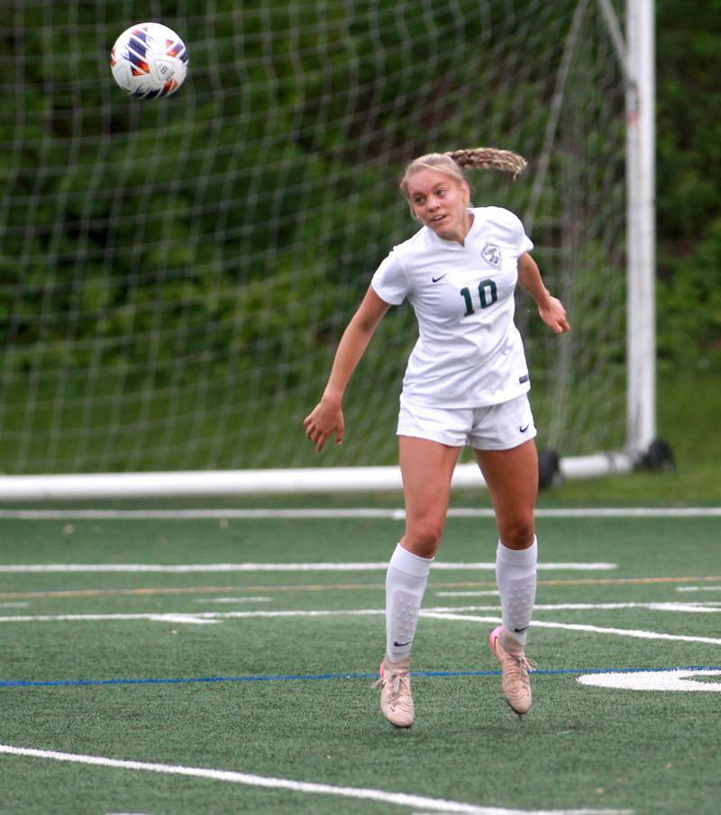 Glenbard West's Jen Gritis heads the ball during a Class 3A Glenbard West Sectional semifinal game against Wheaton Warrenville South on Tuesday, May 27, 2025 in Glen Ellyn.