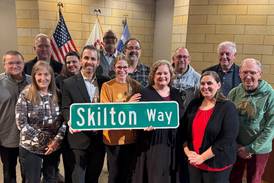 Montgomery dedicates ceremonial street sign to retired Oswego library director