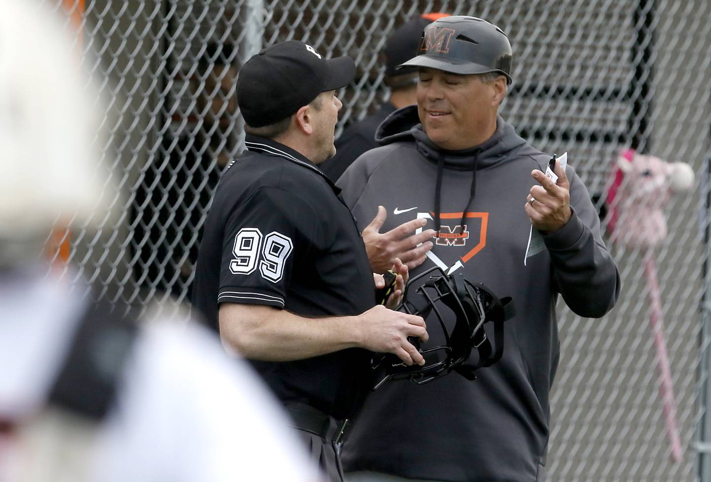 McHenry Head Baseball Coach Brian Rockweiler talks with the umpire during a Fox Valley Conference baseball game against Crystal Lake Central on Friday, May 2, 2025, at McHenry High School.