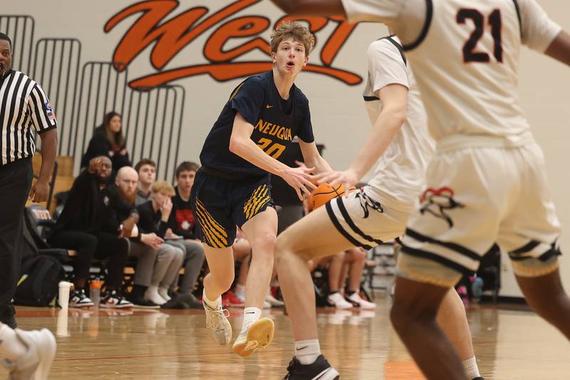 Neuqua Valley’s Mason Martin works the ball upcourt against Lincoln-Way West on Saturday, Feb. 1, 2025.