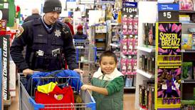 Joliet police officers help children shop for Christmas gifts