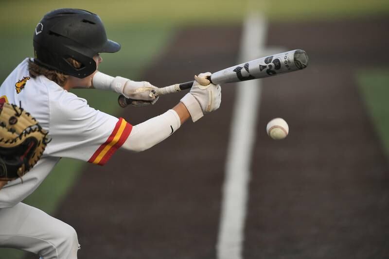 Batavia’s Matthew Reksnis lays down a sacrifice bunt in the five-run first inning against Wheaton Warrenville South in a Class 4A sectional semifinal game in Elgin on Wednesday, May 31, 2023.