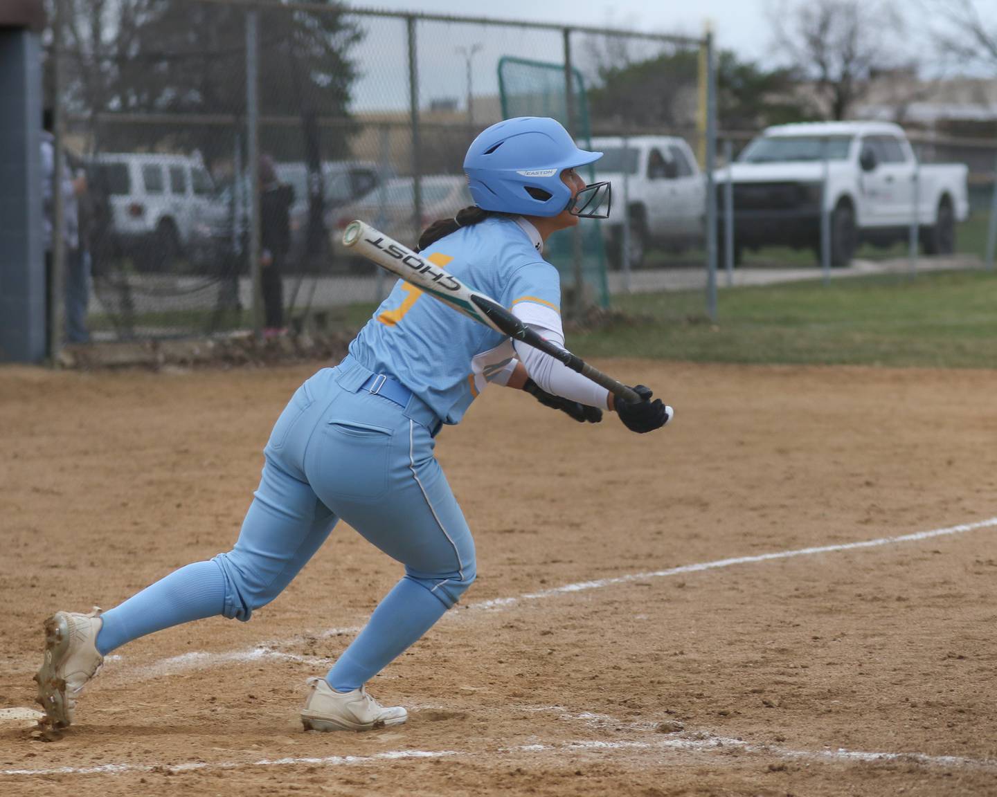 Joliet Catholic's Leah Pena (5) follows through on a swing for a hit during softball game between Joliet West at Joliet Catholic on Thursday, March 27, 2025  in Joliet.
