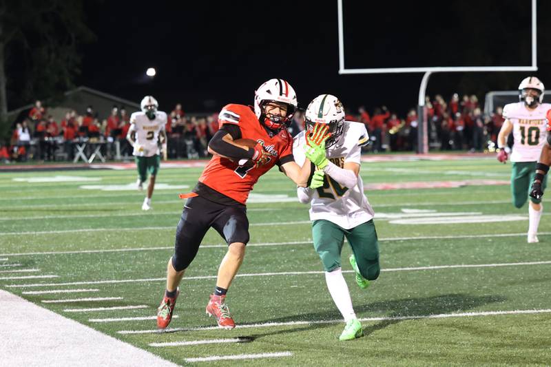Bradley-Bourbonnais' Isaac Allison runs up the sideline for a first down before Waubonsie Valley's Christian Korzeniowski forces him out of bounds during the Boilermakers' 35-6 victory over Waubonsie Valley Friday, Sept. 12, 2025.