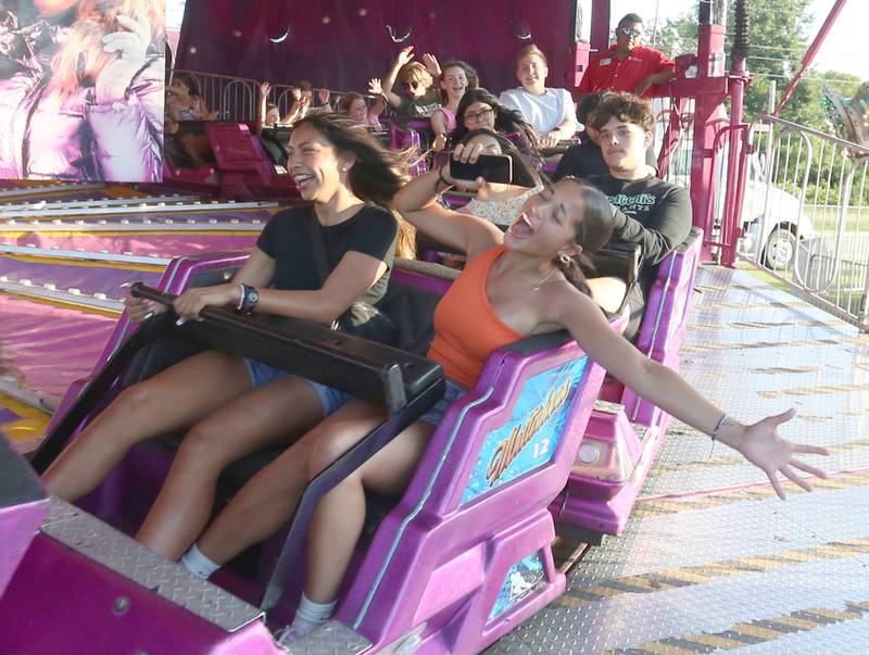 Alexandria Virini and Vision Byrd  of Peru, ride the Matterhorn carnival ride during the Summer Fun Fest on Friday, June 14, 2024 in Oglesby.