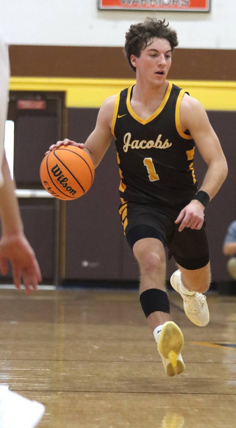 Jacobs’ Ben Jurzak moves the ball against Barrington during Hinkle Holiday Classic varsity boys basketball tournament action on Monday, Dec. 23, 2024 at Jacobs High School in Algonquin.