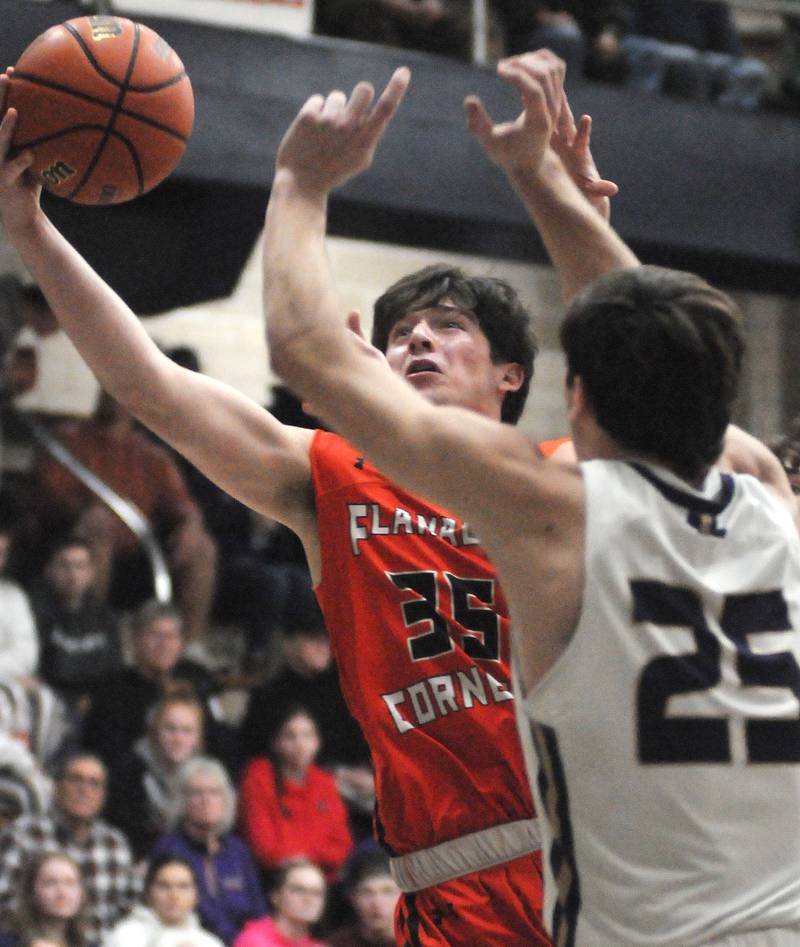 Flanagan-Cornell's Kesler Collins shoots past Serena's Richie Armour in the Marquette Christmas Tournament semifinals on Thursday, Dec. 28, 2023.