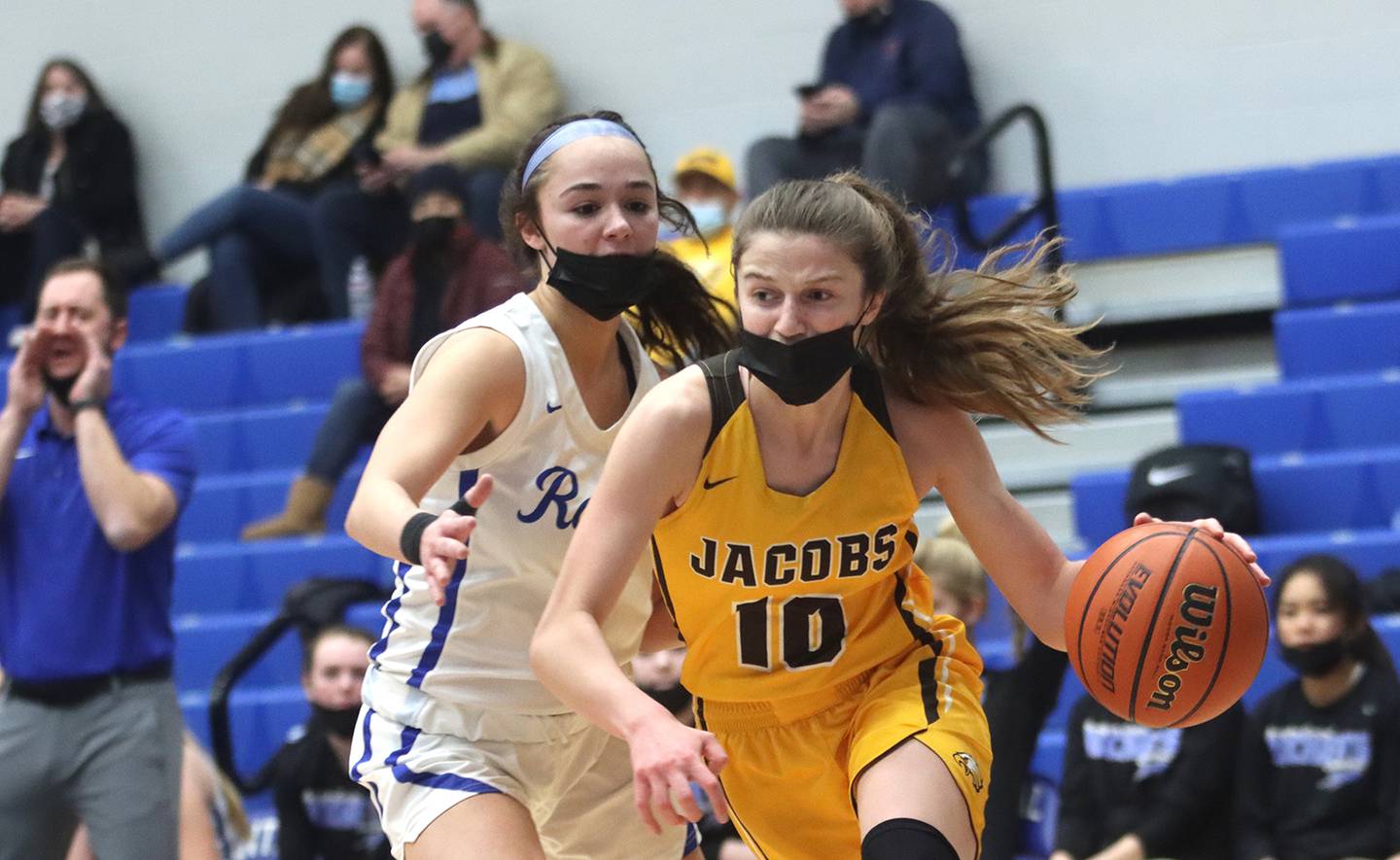 Jacobs’ Mackenzie Leahy, right, drives past Burlington Central’s Rebecca Carani during girls varsity basketball at Burlington Tuesday night.