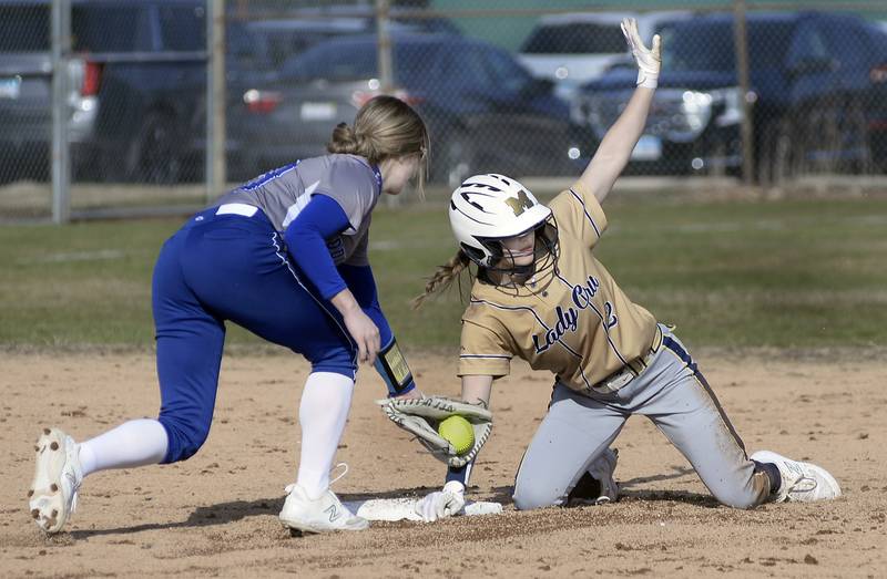 Marquette’s Lindsey Kaufmann avoids the tag by Princeton’s Malaya Hecht on a stolen base in the 2nd inning on Monday, March 27, 2023 at Marquette.