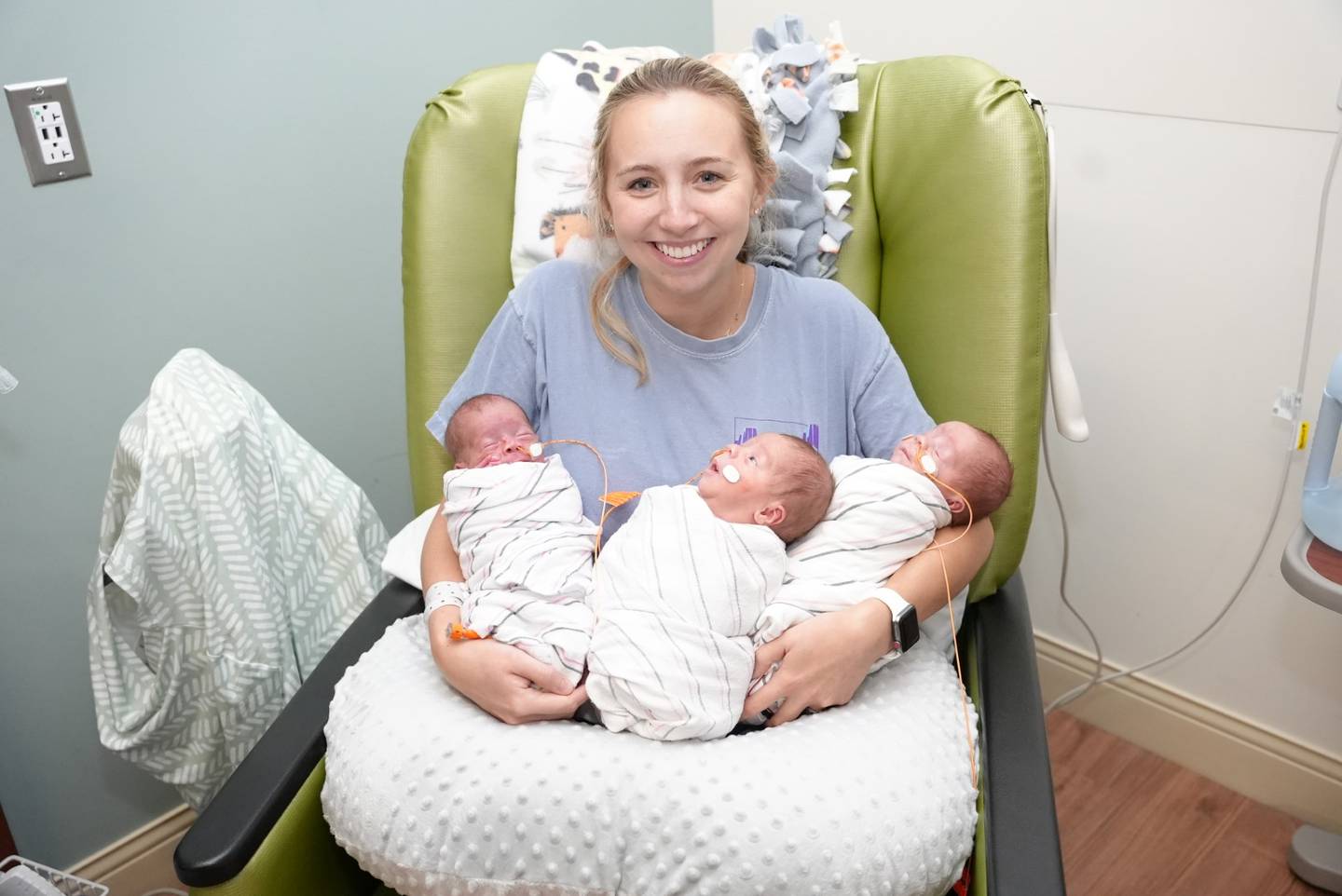 Samantha LeSage of Manteno holds her triplet sons Miles, Lane and Elijah at Silver Cross Hospital in New Lenox. The triplets were born June 5, five weeks before Silver Cross' NICU celebrated its first anniversary.