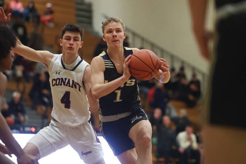 Lemont’s Matas Castillo passes the ball against Conant in the Jack Tosh Holiday Classic at York High School on December 27th.