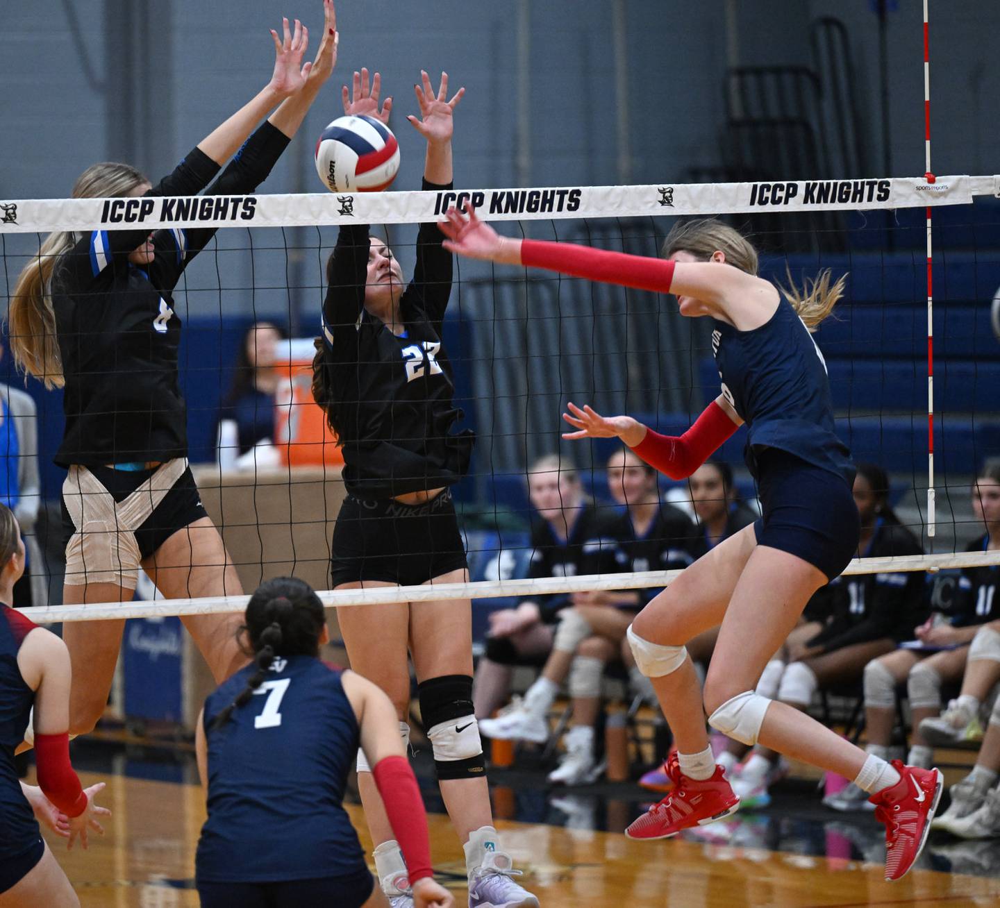 Burlington Central’s Ainsley Wilson, left, and  Joselyn Johnson try to block a ball spiked by St. Viator’s Avery Albritton during the Class 3A IC Catholic Prep girls volleyball sectional final on Thursday, Nov. 6, 2025 in Elmhurst.