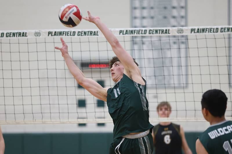 Plainfield Central’s Ethan Ricketts sets the ball against Joliet West on Tuesday, April 23, 2024 in Plainfield.
