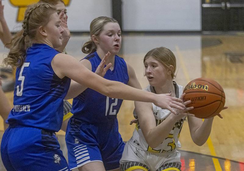 Putnam County's Salina Breckenridge is double teamed by Newark's Taylor Kruser and Tess Carlson during the Class 1A Regional final game on Thursday, Feb. 16, 2023 at Putnam County High School.
