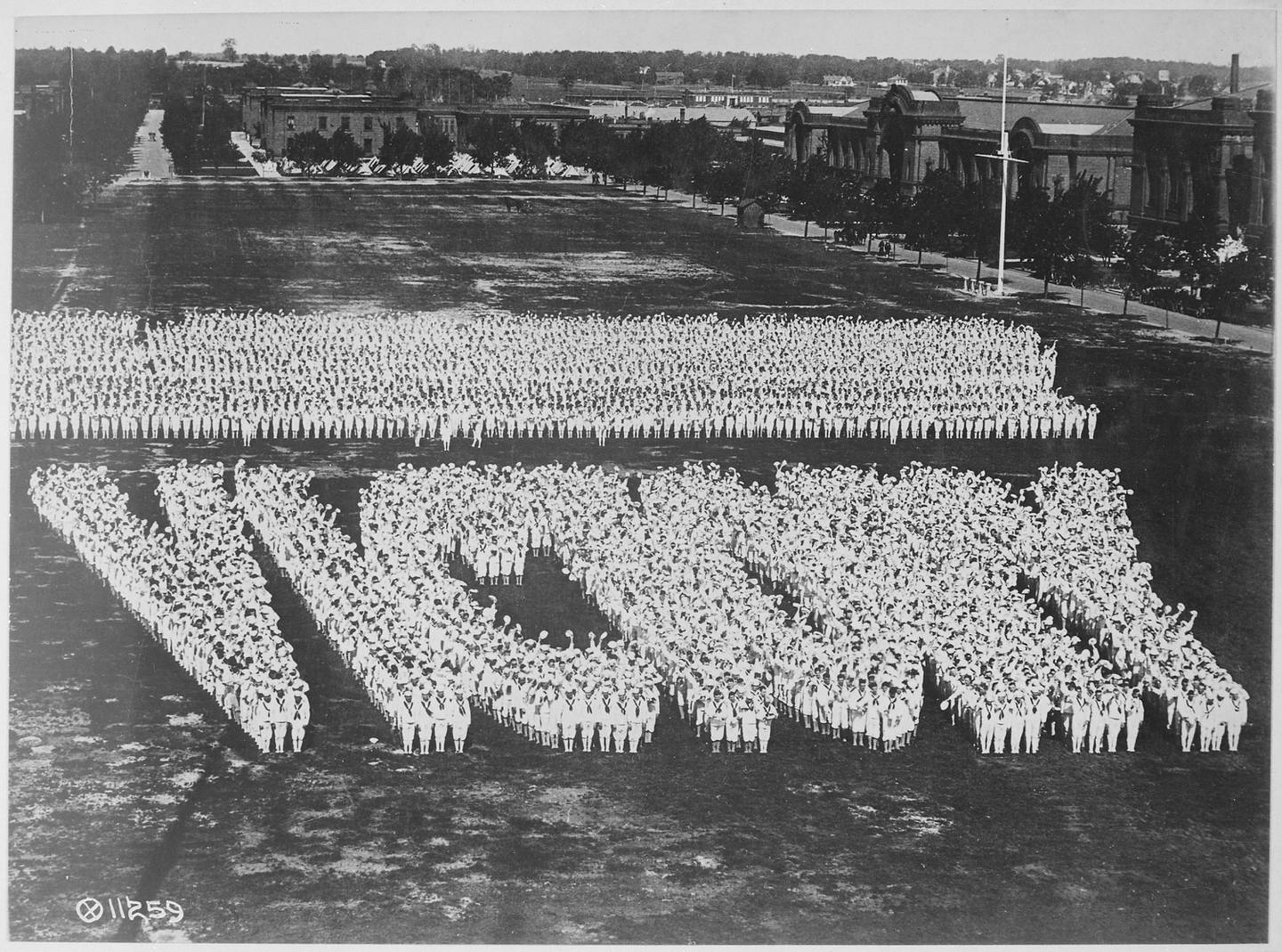 "Victory" is spelled by Naval Station Great Lakes sailors in World War I.